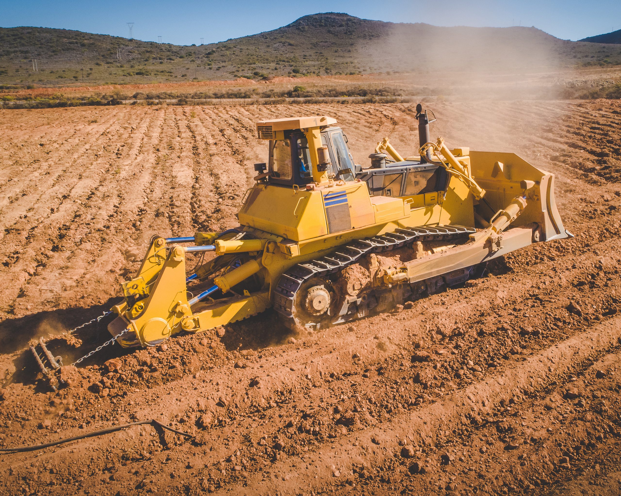 Aerial image of a bulldozer pushing and ripping ground on an agr